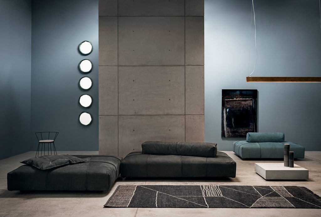 Berbère Dark Grey + Natural | Pattern A. Rug decorated with a woolen stitching in a living room.