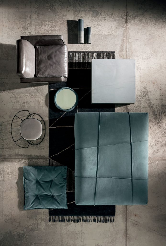 Berbère Dark Grey + Natural | Pattern A. Rug decorated with a woolen stitching in a living room.