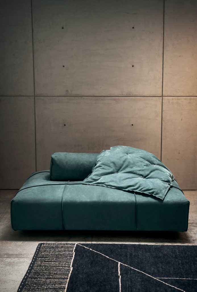 Berbère Dark Grey + Natural | Pattern A. Rug decorated with a woolen stitching in a living room.