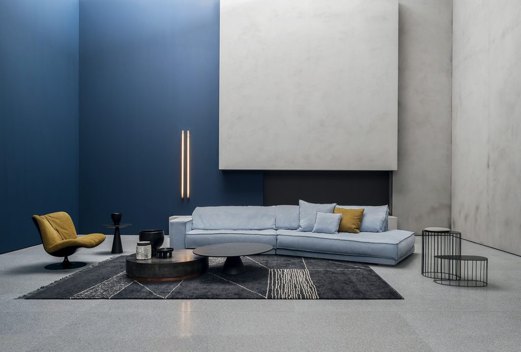 Berbère Dark Grey + Natural | Pattern A. Rug decorated with a woolen stitching in a living room.