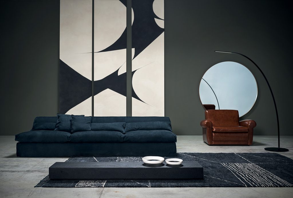 Berbère Dark Grey + Natural | Pattern A. Rug decorated with a woolen stitching in a living room.