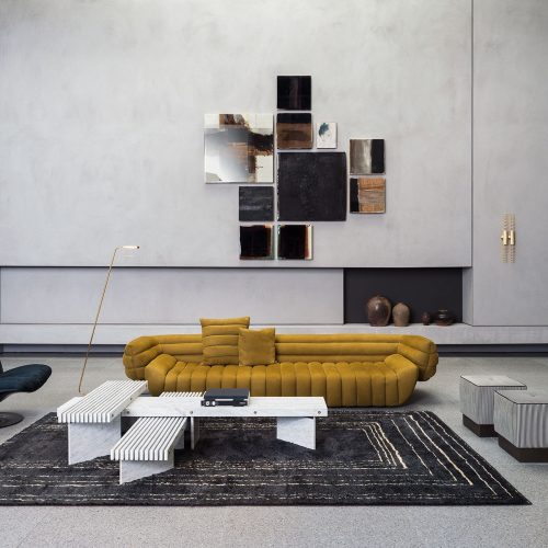 Berbère Dark Grey + Natural | Pattern B. Rug decorated with a woolen stitching in a living room.
