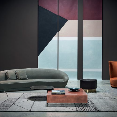 Berbère Light Grey + Dark Brown | Pattern A. Rug decorated with a woolen stitching in a living room.