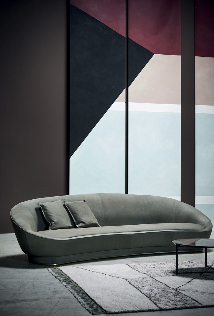 Berbère Light Grey + Dark Brown | Pattern A. Rug decorated with a woolen stitching in a living room.