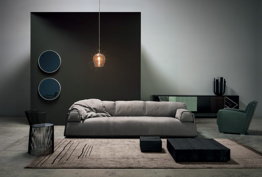 Berbère Light Grey + Dark Brown | Pattern B. Rug decorated with a woolen stitching in a living room.