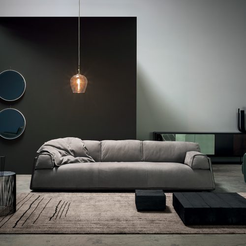 Berbère Light Grey + Dark Brown | Pattern B. Rug decorated with a woolen stitching in a living room.