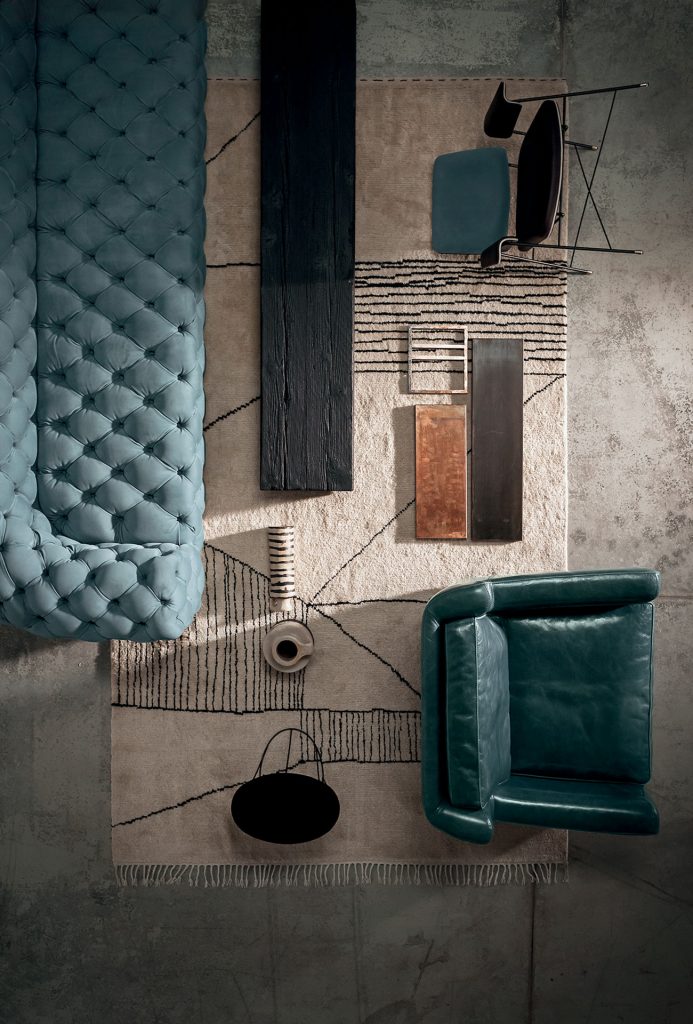 Rug decorated with a woolen stitching in nero and black pattern in a living room.