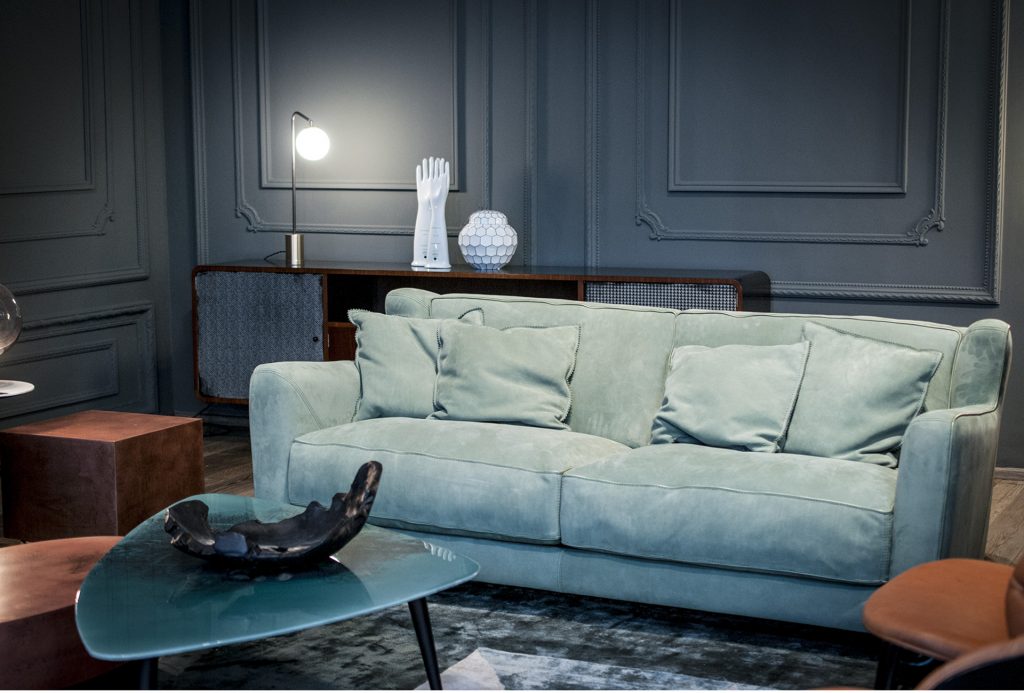 Single-part frame. Green Seat cushions and back cushions leather in a living room.