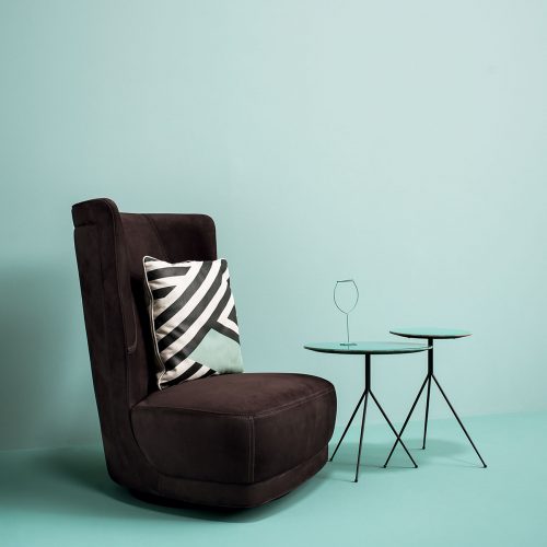 Brown Etienne Sofa. Backrest frame in curved plywood and seat in pine and beech. Double decorative edge. Matte black-varnished metal revolving base.