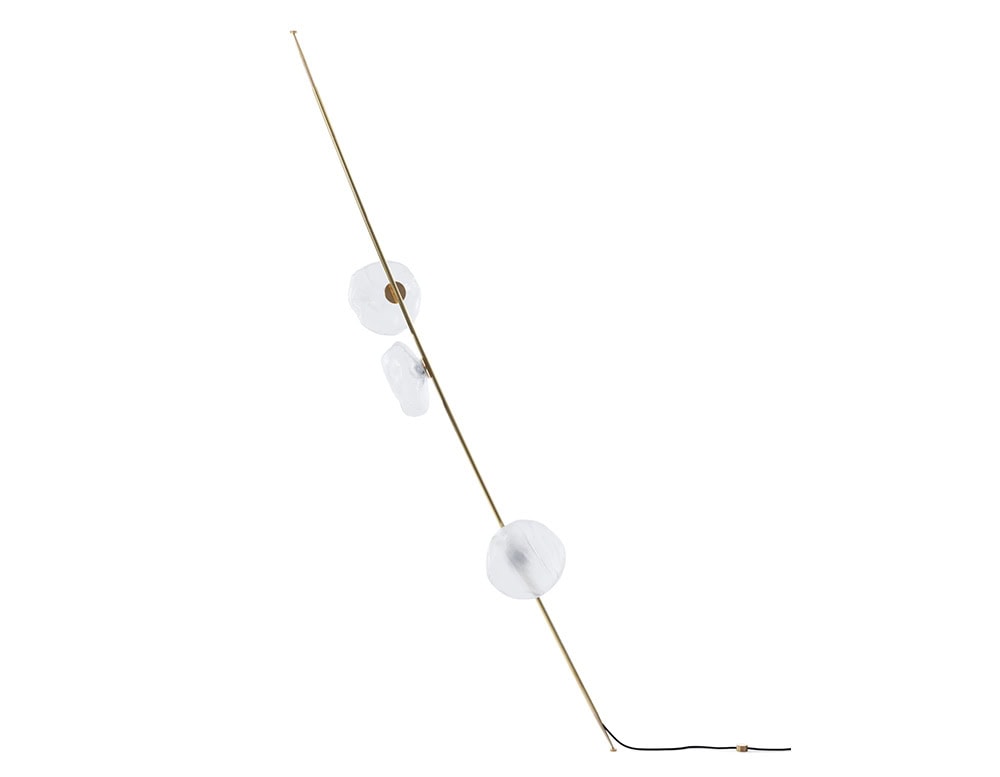 Boc Stem Column Floor Light features a slim brass stem with delicate glass orbs in milky white. Its sculptural silhouette leans gently, adding an ethereal accent to any minimal or contemporary setting.