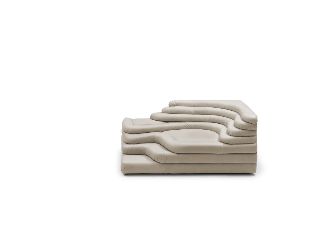 A white cream DS Thousand twenty five sofa element. The single element is a terraced hill with widths and depths that vary in tapering steps on a white background.