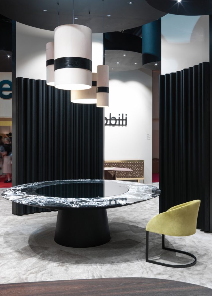 decorative panel in the form of horizontal lines made of a wooden base in a black colour tone in a living room