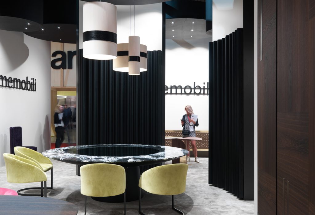 decorative panel in the form of horizontal lines made of a wooden base in a black colour tone in a living room