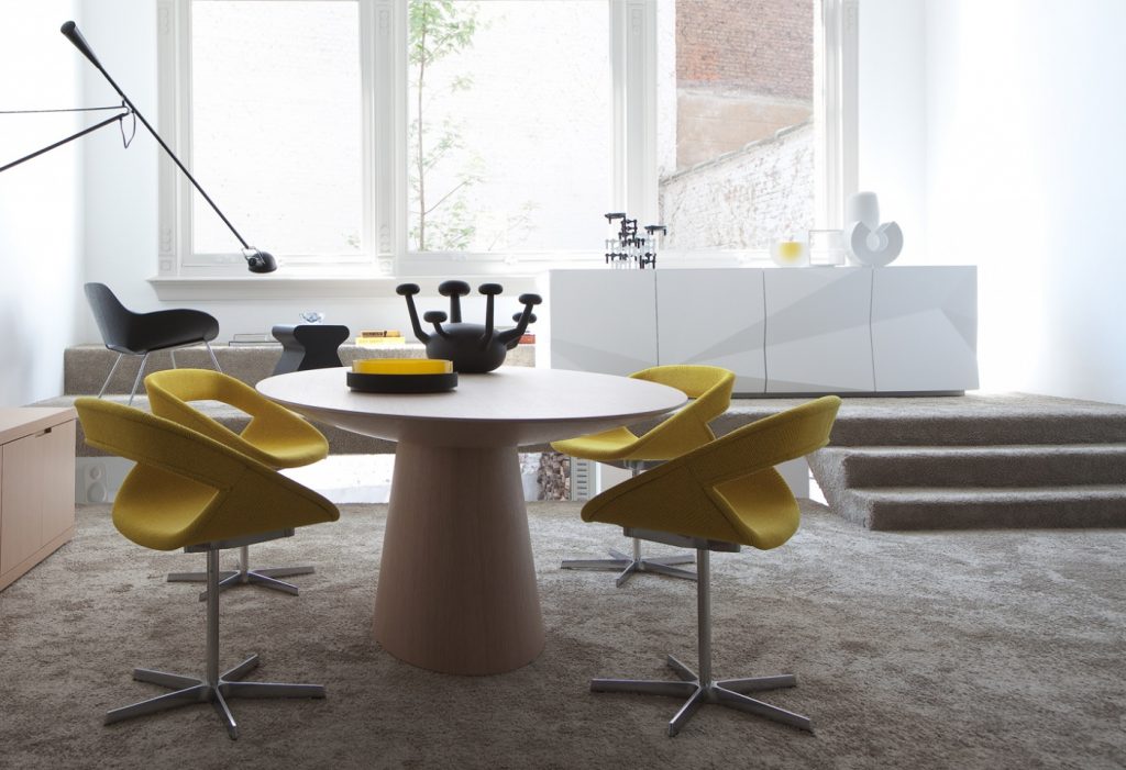 storage furniture made of veneered wood in a white tone next to a dining room