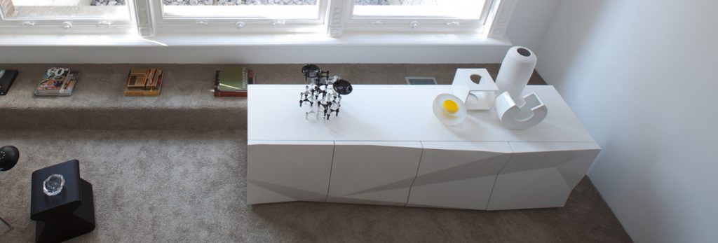 sideboard made of veneered wood base in a white tone in a living room