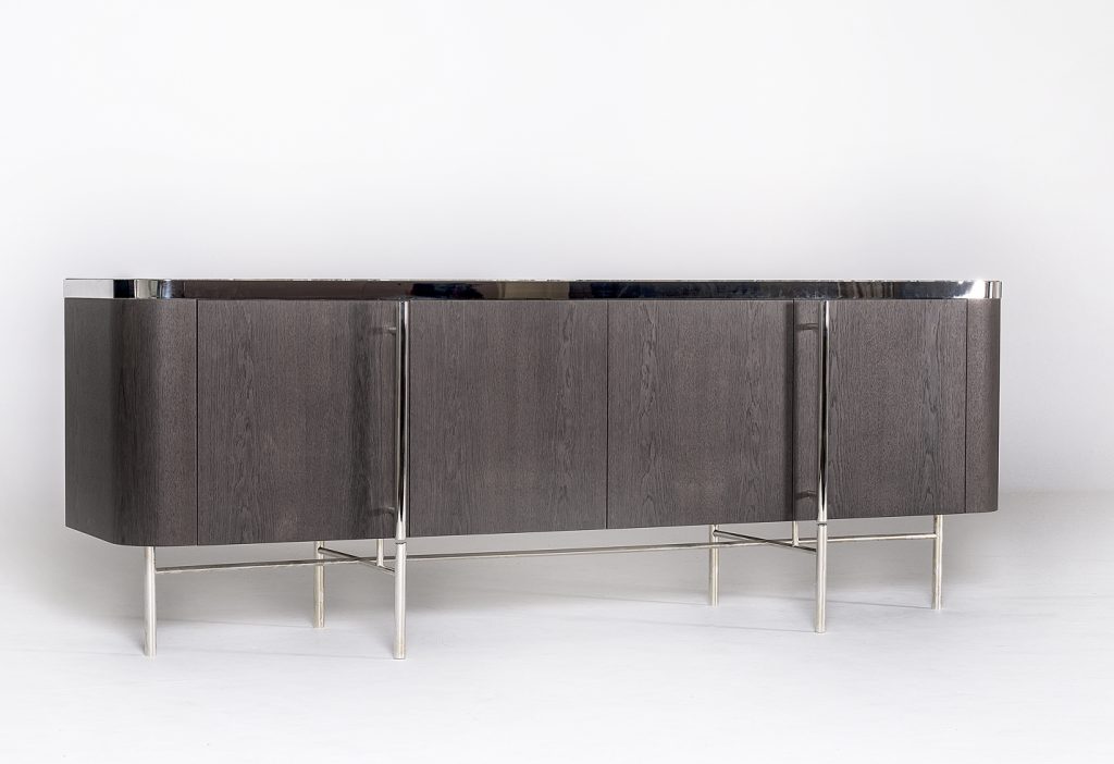 storage furniture made of a wooden base and transparent glass top, steel legs on a white background