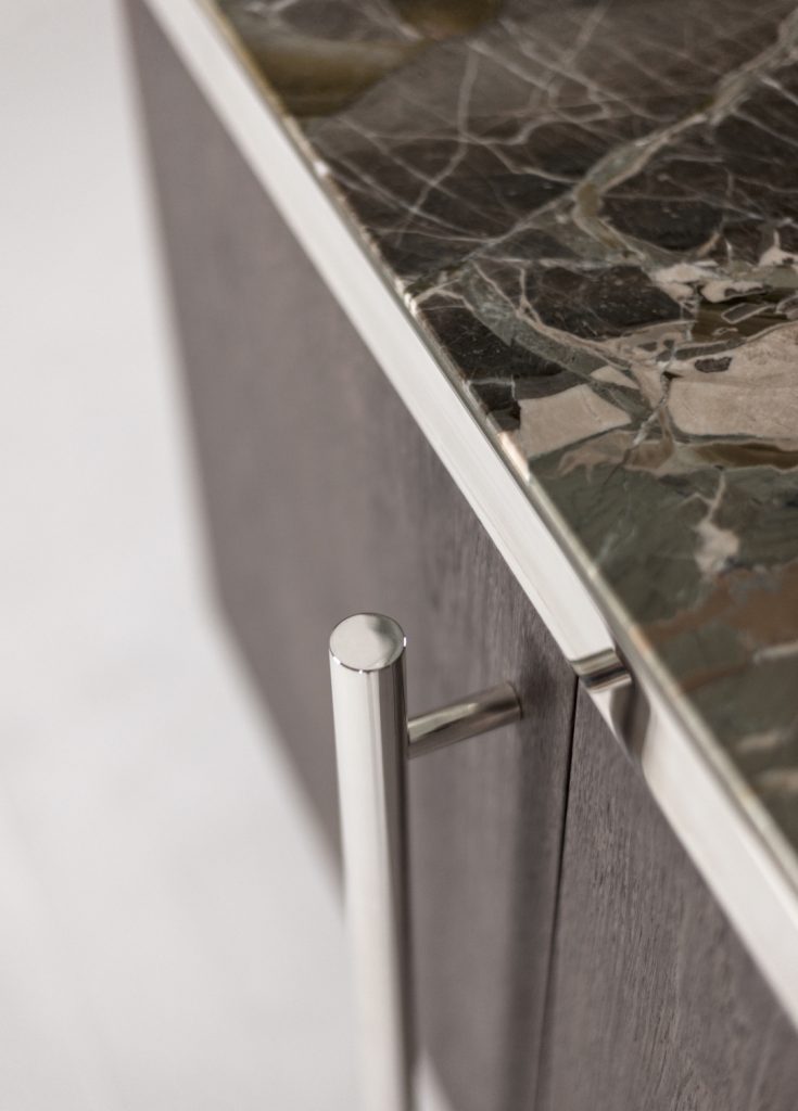 storage furniture made of a wooden base and transparent glass top, steel legs on a white background