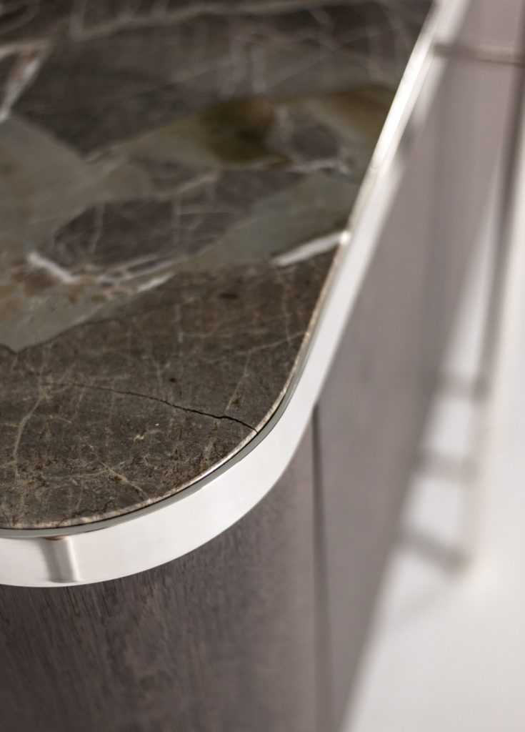 storage furniture made of a wooden base and transparent glass top, steel legs on a white background