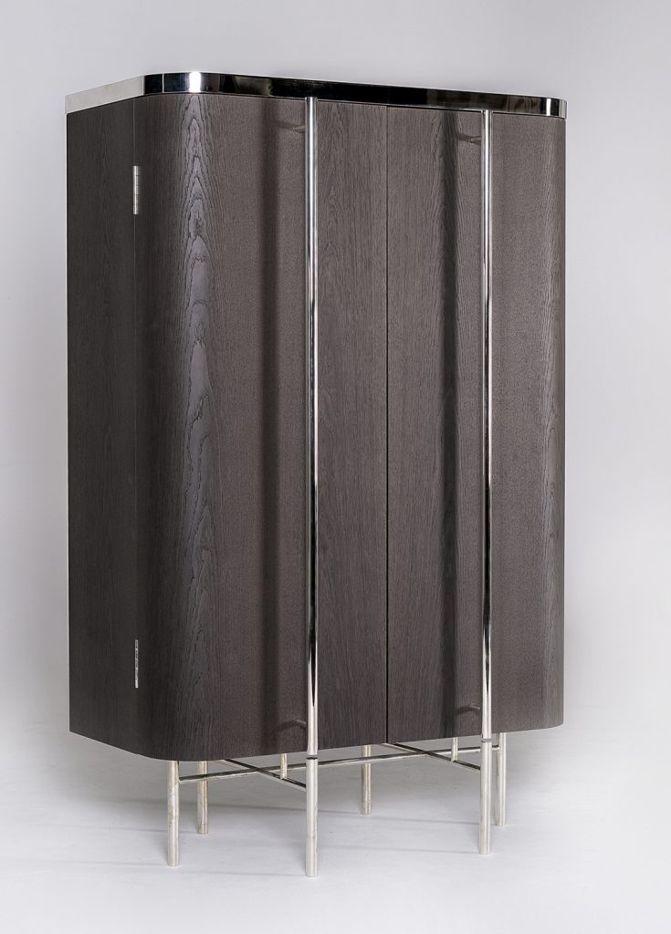 vertical furniture made of a wooden, glass and steel base with internal drawers on a white background