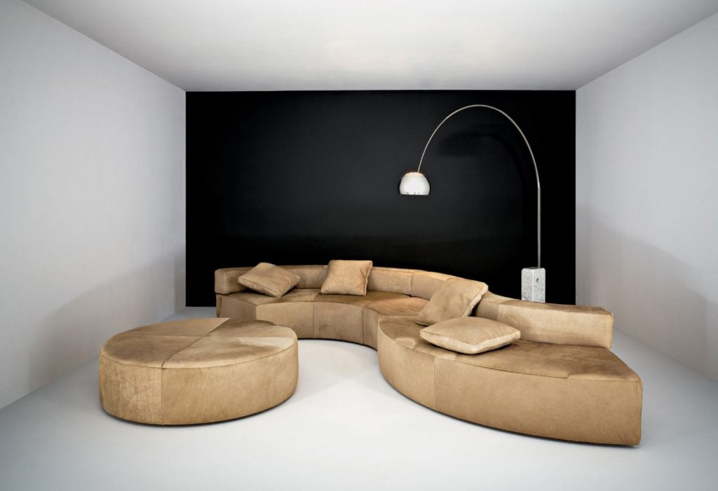 modular sofa made on a wooden base and covered in a yellow snake-shaped fabric