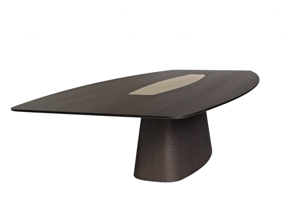 designer table made on a solid wood base in the shape of an oval in a black colour tone with brass details