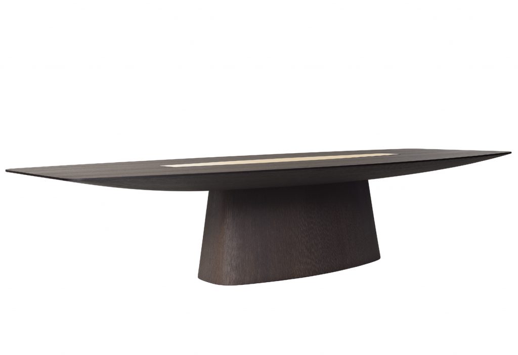 designer table made on a solid wood base in the shape of an oval in a black colour tone with brass details