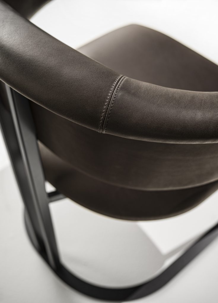 upholstered in leather or velvet in a black tone on a white background