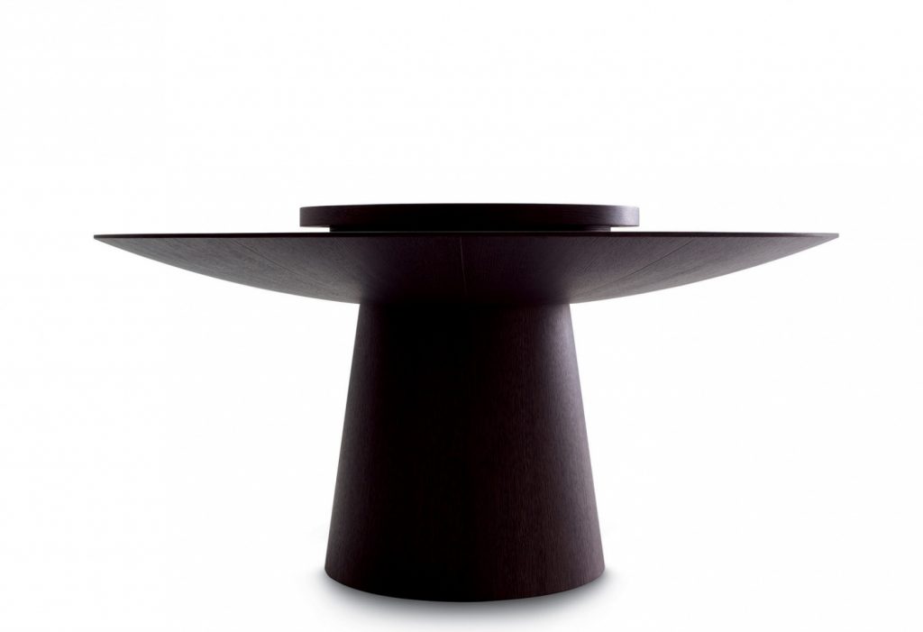 coffee table made of a circular wooden base made in a black colour tone on a white background