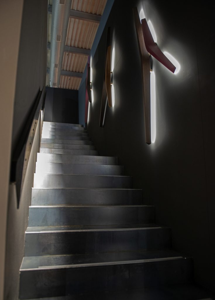 ceiling lamp made of a brass base in the shape of lines made in a bronze colour tone