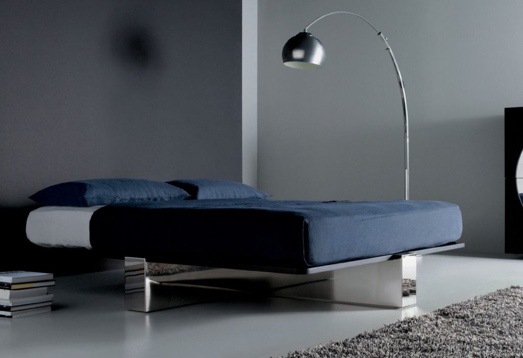 Double bed without headboard made on an oak wood base (without mattress) in a white colour tone in a room