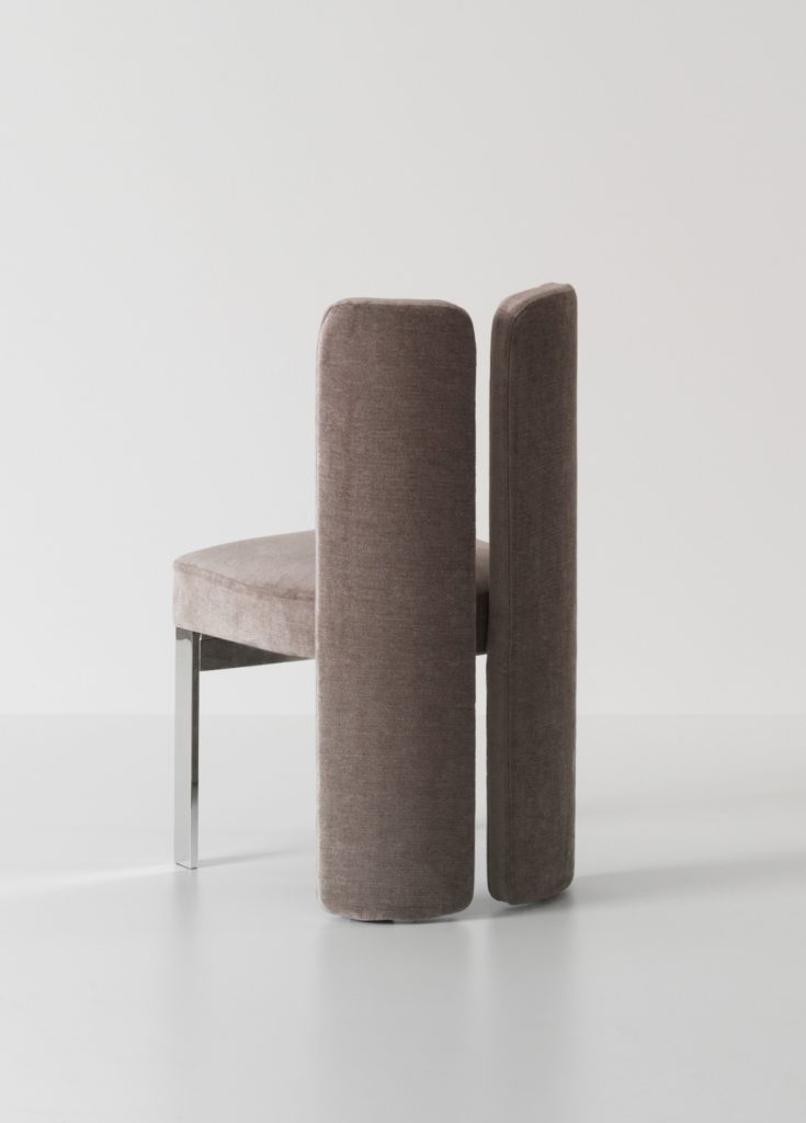 Plush velvet chair with a sleek silver base.