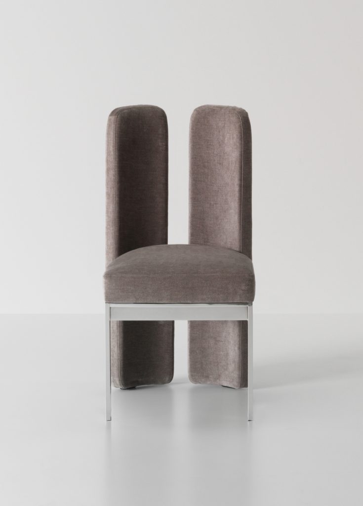 Elegant seating with a tall back for support.