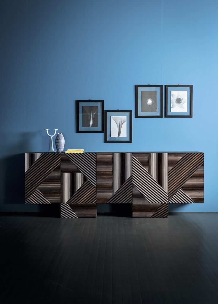 Stripes Cabinet: Large cabinet with brown vertical striped pattern and multiple drawers in front of a blue wall.