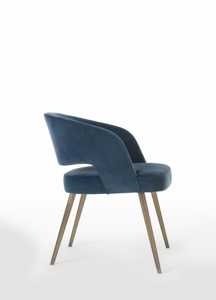 armchair made of a wood and metal base upholstered in leather in a blue tone on a white background