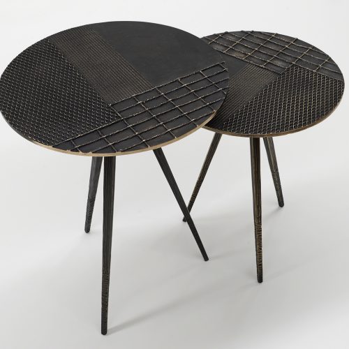 two coffee tables with surfaces decorated on a wooden base and textures in a black color tone