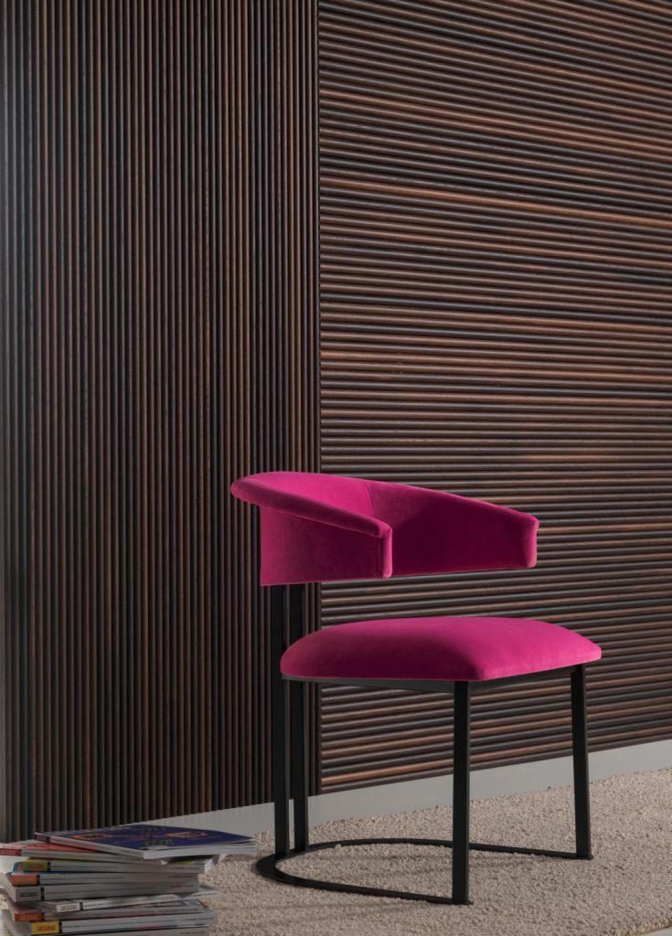 wall covering made of oak wood with a linear design in a dark brown tone with a chair in front