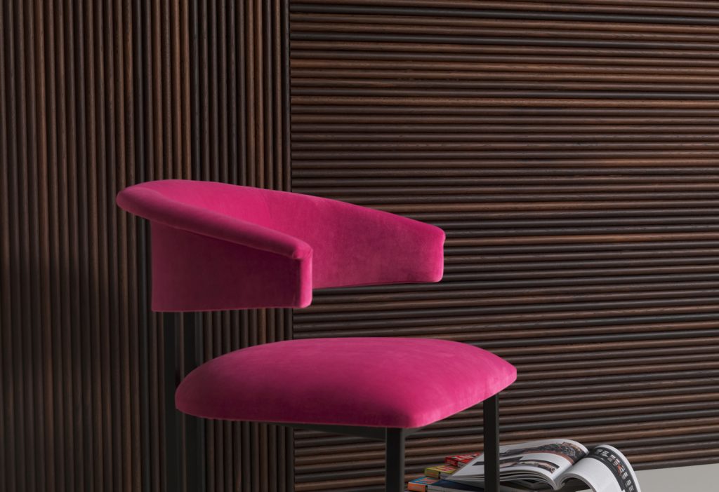 wall covering made of oak wood with a linear design in a dark brown tone with a chair in front