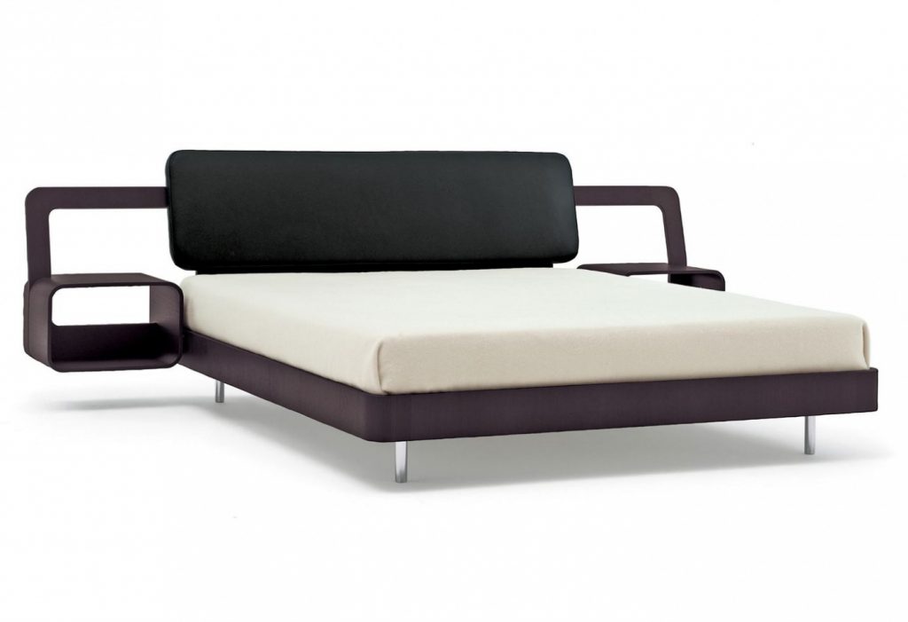 Bed made of a wooden base covered in leather in a white, black and brown colour tone on a white background