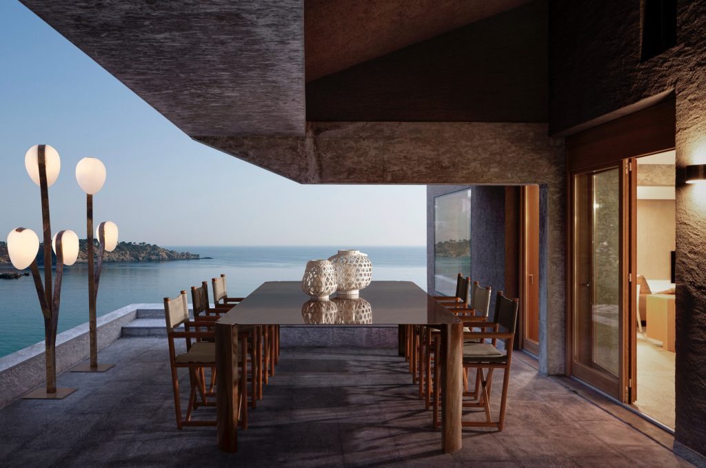 10th Bridge Table: Rectangular table with a wooden top and four legs on a terrace.