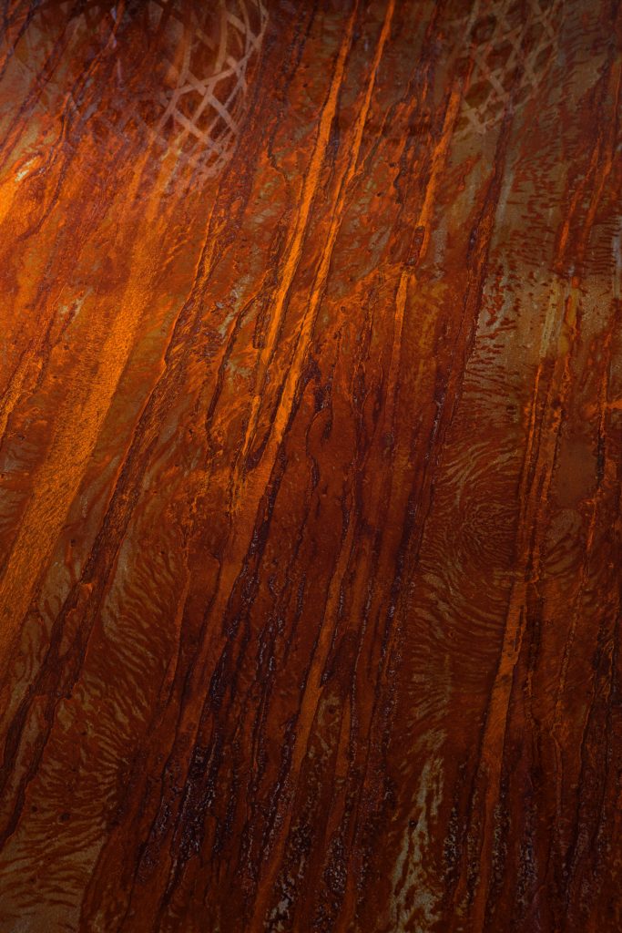 Closeup of 10th Bridge Table: Rectangular table with a wooden top.