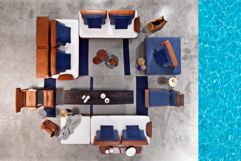 Caprera Chest: Large wooden storage chest with two legs in a living room.
