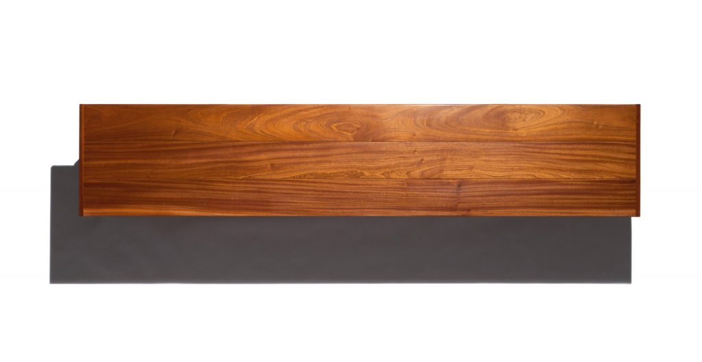 Caprera Chest: Large wooden storage chest with two legs on a white background.