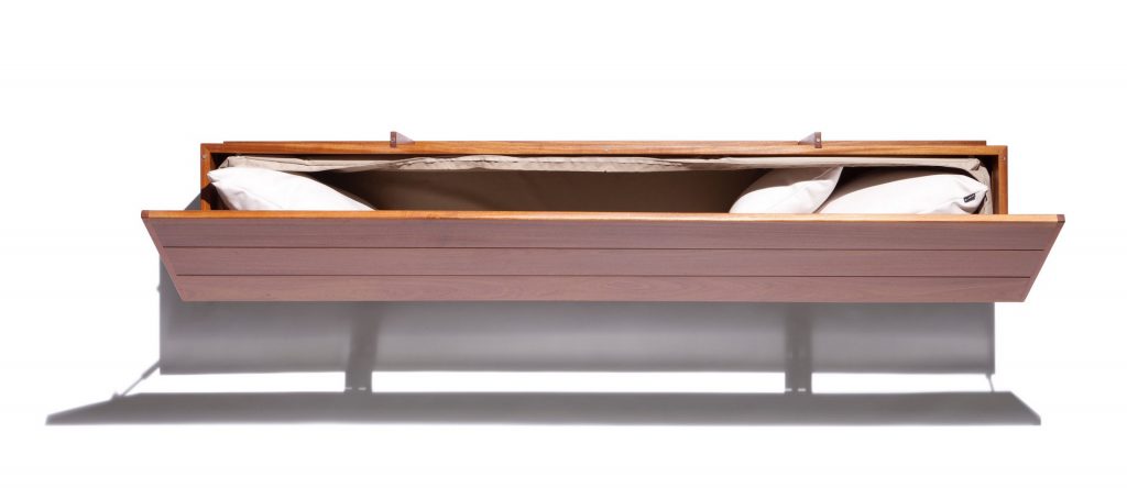 Caprera Chest: Large wooden storage chest with two legs on a white background.