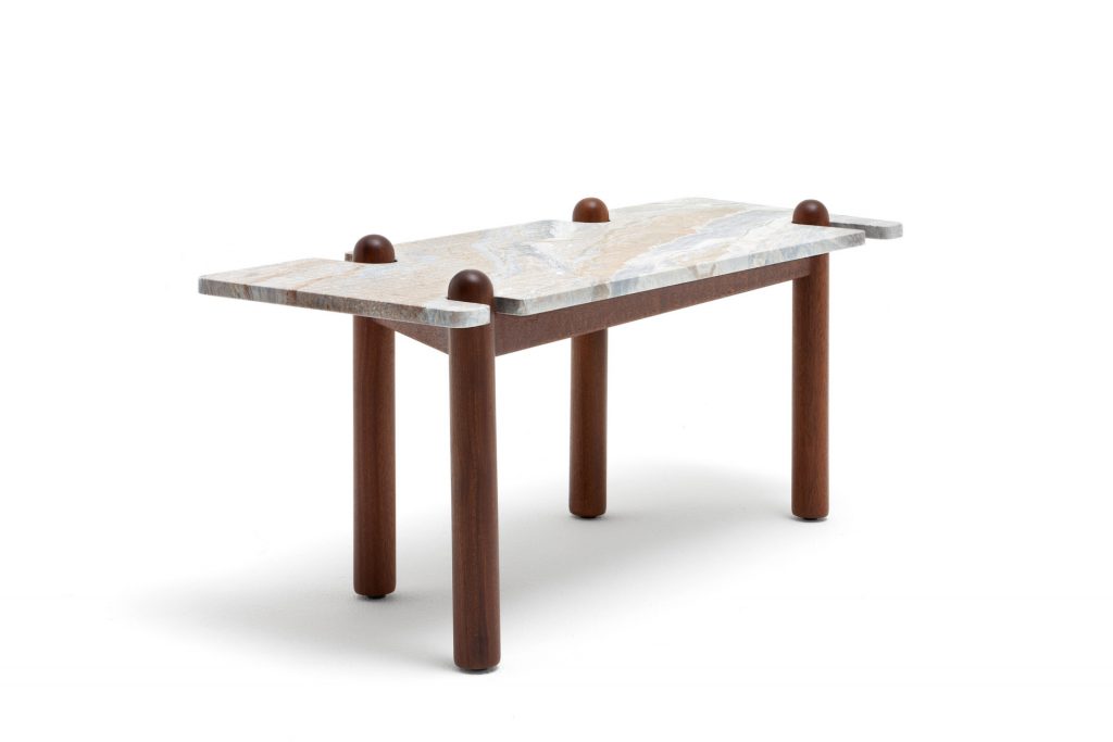 Caprera Coffee Table. Gray stone square top with four sleek brown legs on a white background.