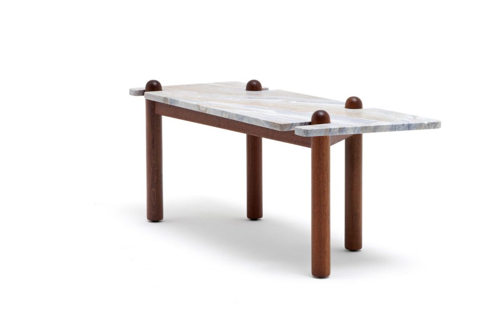 Caprera Coffee Table. Gray stone square top with four sleek brown legs on a white background.