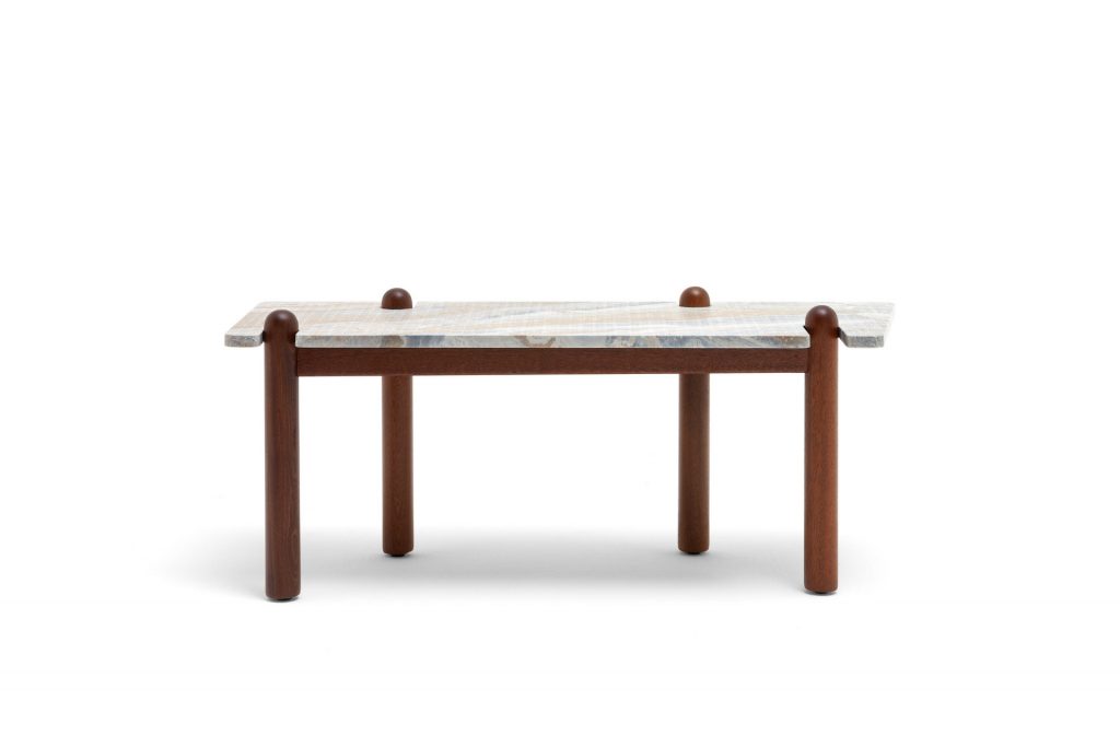 Caprera Coffee Table. Gray stone square top with four sleek brown legs on a white background.