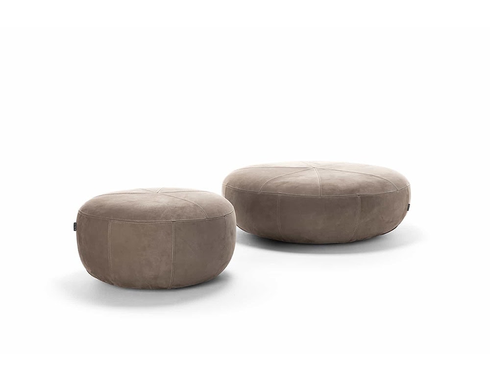 Two 10th Clove Outdoor Poufs with rounded shapes and textured brown fabric are positioned side by side against a white background