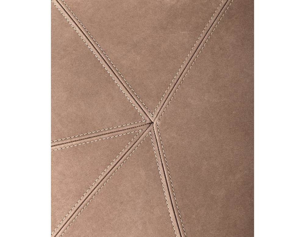 A close-up of a 10th Clove Outdoor Pouf shows a textured brown fabric with stitched lines forming a star pattern
