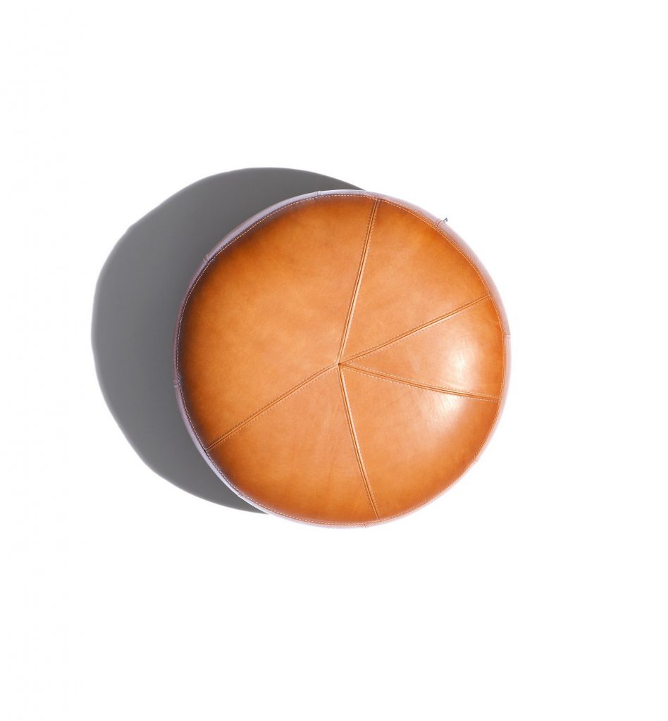 10th Clove Pouf: Round pouf in brown leather fabric on a white background.
