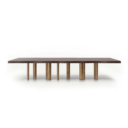 A 10th Joint Dining Table with a long, dark rectangular top and multiple cylindrical legs is shown from a low angle against a white background